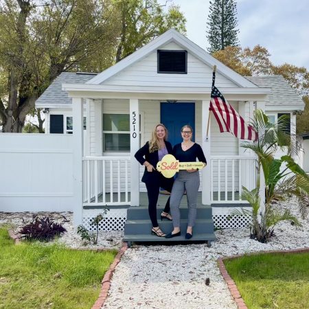 Laura Marie and client in front of newly purchased 3 bedroom 1 bathroom home in Gulfport, FL