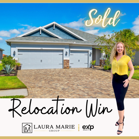 Laura Marie standing in front of a sold home in the Trevesta community in Palmetto, FL